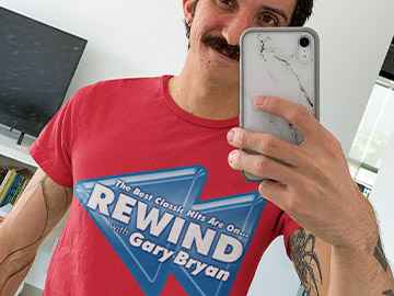 Guy wearing a Red Rewind with Gary Bryan Shirt