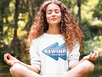 Girl wearing a white Rewind with Gary Bryan Sweatshirt