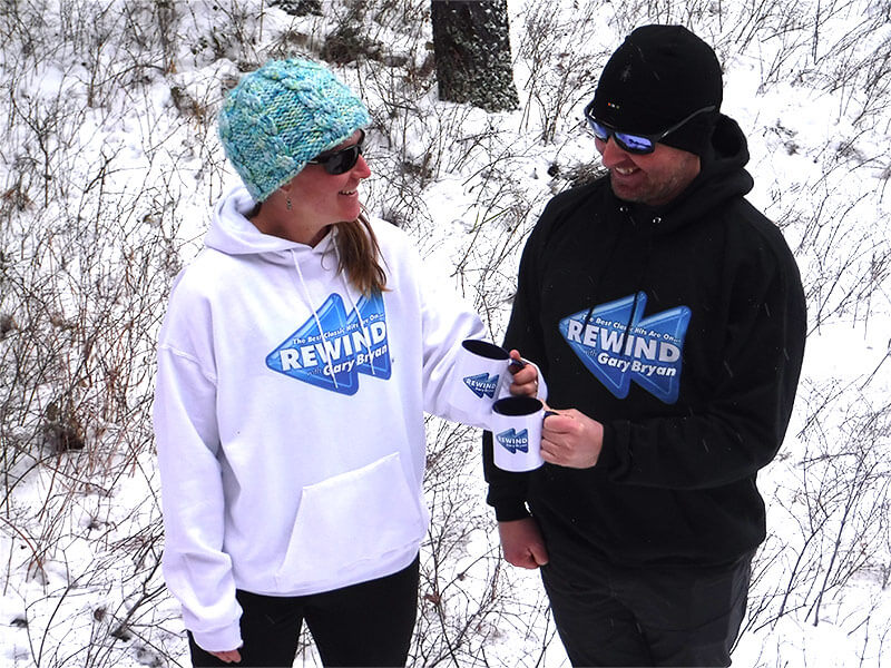 12-29-21_JohnstonFamily_800x600_opt Woman and Man wearing hoodies with the Rewind logo on them.